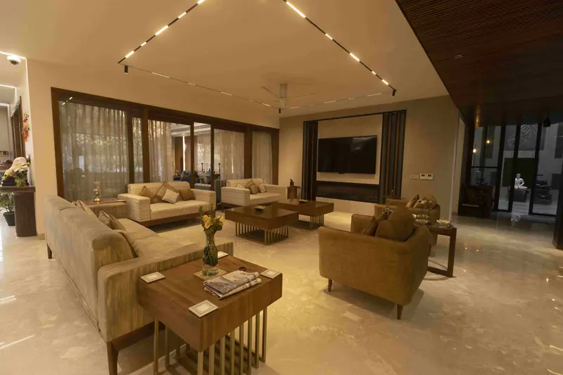 Interiors Contemporary: living room with layered seating, timber tables and full-height glazing