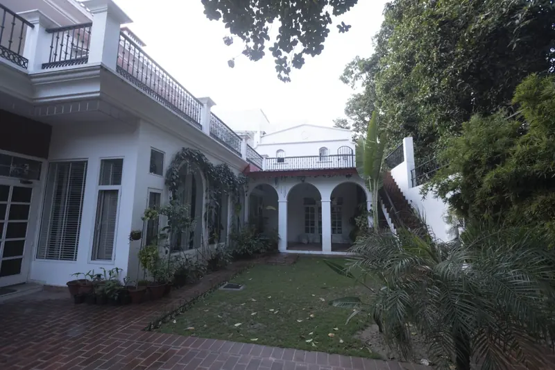 Arcadia: lawn courtyard enclosed by the residence's white arched verandas