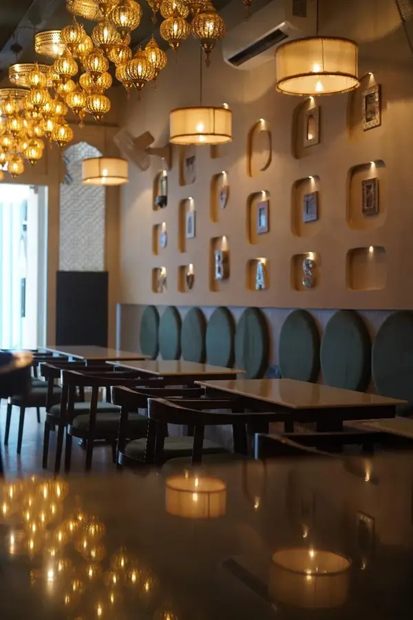 Basha Kabob, Sector 68, Mohali: restaurant with brass lanterns, framed wall niches and booth seating